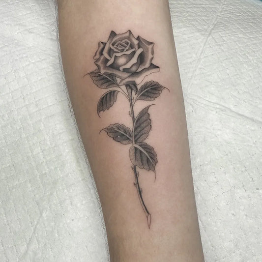 Small Blackwork Rose on Women Arm Tattoo by @lopeztatuagens