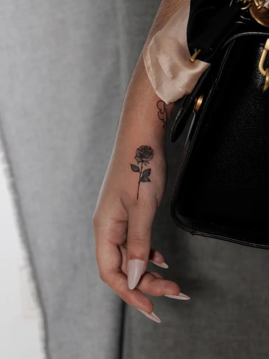 Small Blackwork Rose on Women Forearm Tattoo by @jorg_fwtakidis