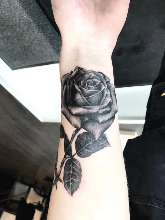 Small Blackwork Rose on Women Wrist Tattoo by @the.sall