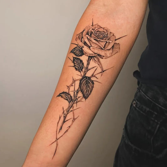 Small Blackwork Rose with Thorns on Women Forearm Tattoo by @david.arato