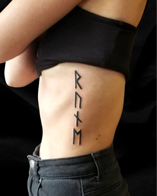 Small Blackwork Runes Tattoo on Women Rib by @thecopperwolf