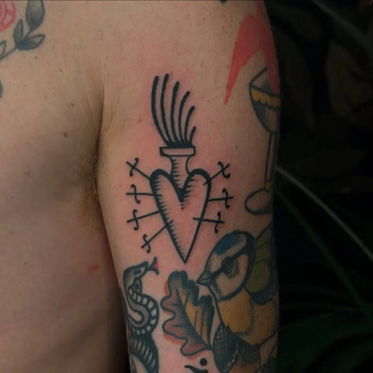 Small Blackwork Sacred Heart Bird and Snake Tattoo on Men Arm by @son_of_ilio