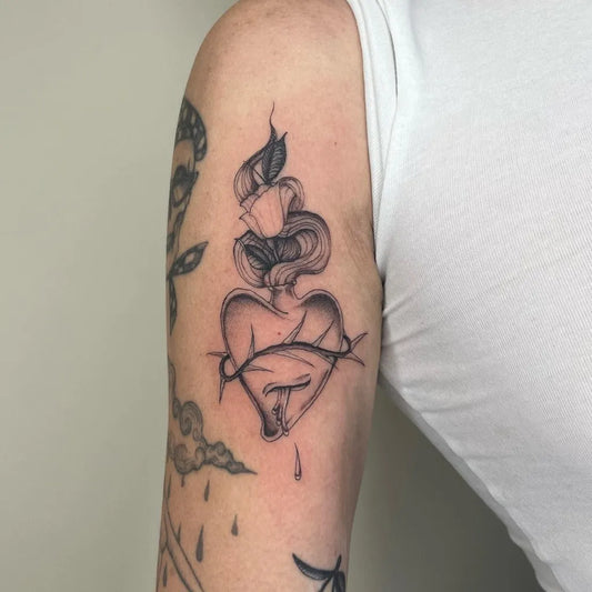 Small Blackwork Sacred Heart Tattoo on Women Upper Arm by @joearizmenditattoo