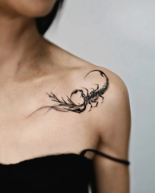 Small Blackwork Scorpion and Flowers on Women Shoulder Tattoo by @sansa.jr.tattoo