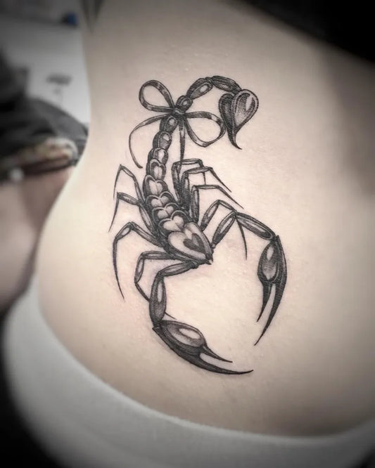 Small Blackwork Scorpion with Bow on Women Hip Tattoo by @60needle