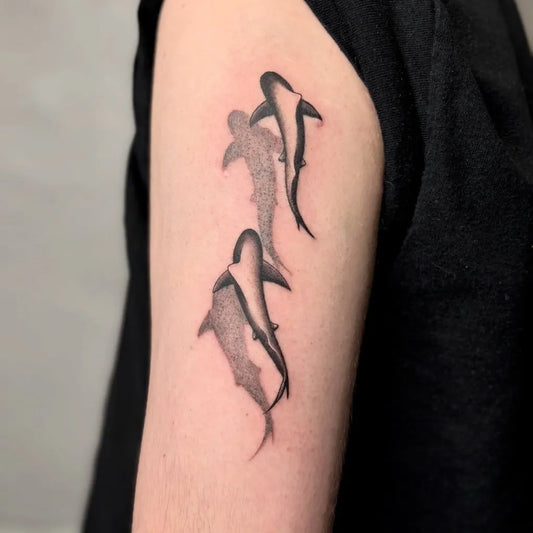 Small Blackwork Sharks on Men Arm Tattoo by @_seli.ink_