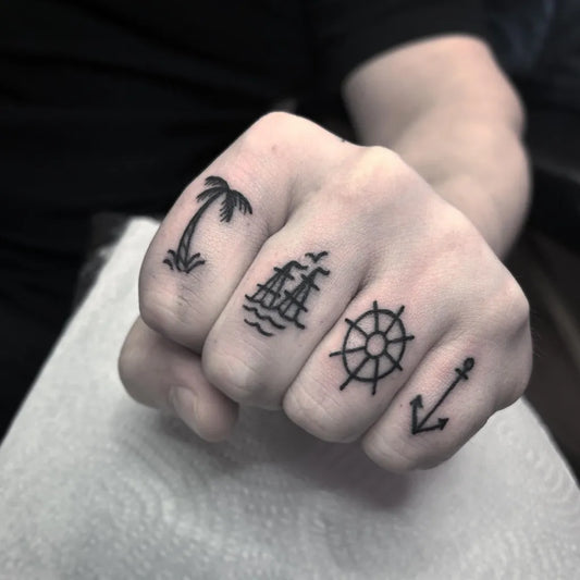 Small Blackwork Ship Palm Tree Anchor Wheel Nautical Tattoo on Men Hand by @tinymamatattoo
