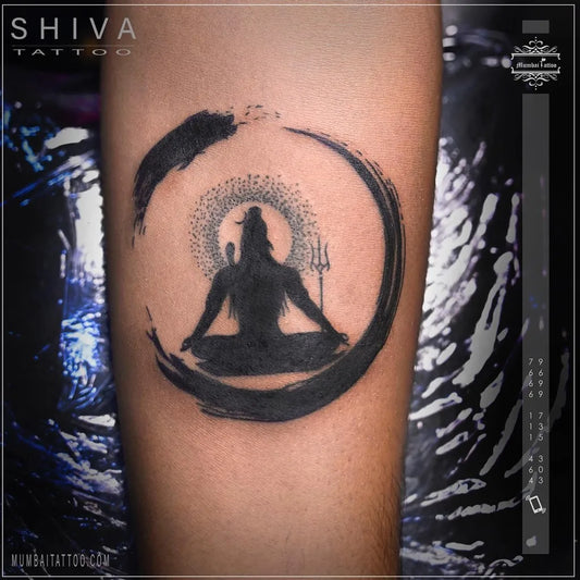 Small Blackwork Shiva in Enso Circle on Men Arm Religious Tattoo by @mumbaitattoostudio