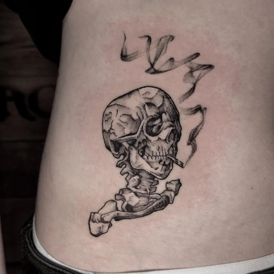 Small Blackwork Skeleton with Smoke Tattoo on Women Hip by @inky_ali