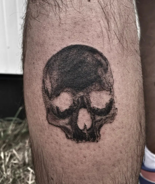 Small Blackwork Skull on Men Leg Tattoo by @inked__kid_