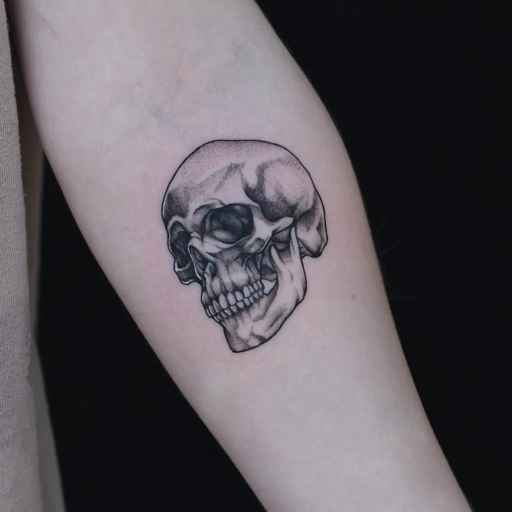 Small Blackwork Skull on Women Arm Tattoo by @laduca_art