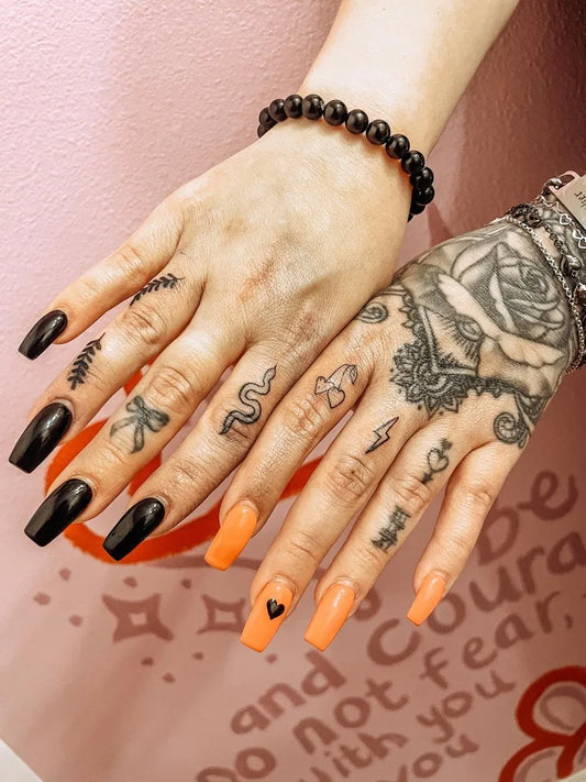 Small Blackwork Snake Rose on Women Fingers Tattoo by @the_homebody_club_tattoo