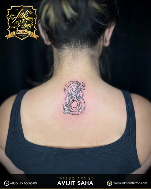 Small Blackwork Snake S on Women Back Tattoo by @inkparktattoobd