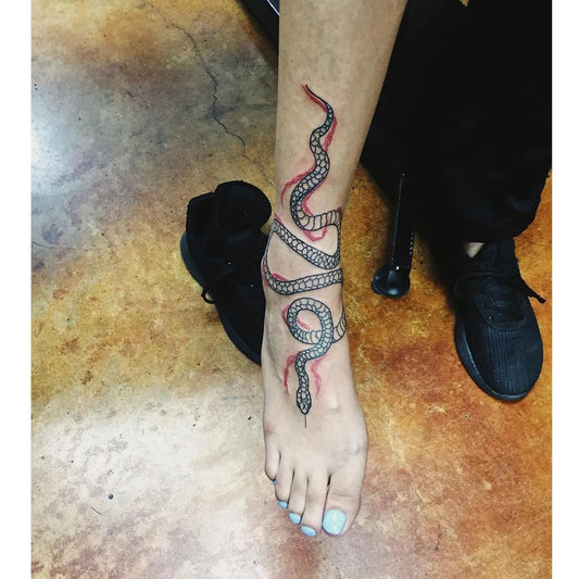 Small Blackwork Snake Tattoo on Women Foot by @villustrated