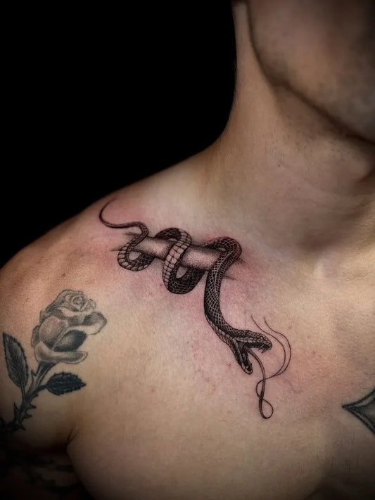 Small Blackwork Snake and Rose on Men Neck Tattoo by @kraven.tatts