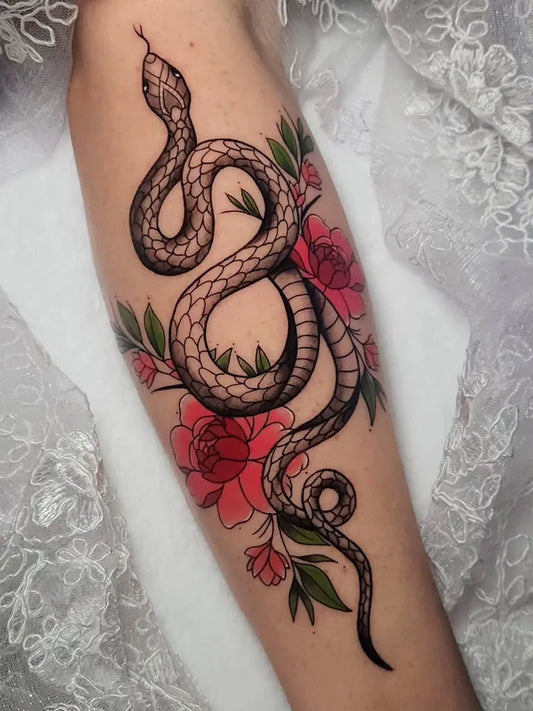 Small Blackwork Snake and Roses on Women Arm Tattoo by @alangctattoos