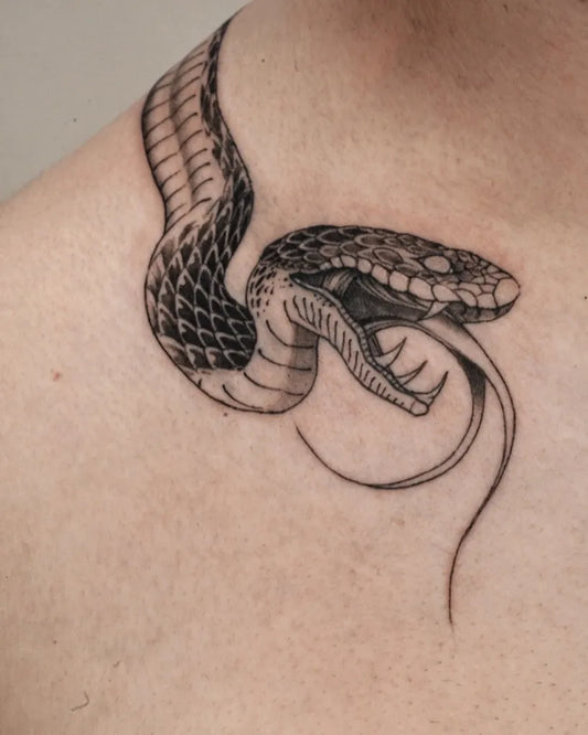 Small Blackwork Snake on Men Shoulder Tattoo by @inkifytattoo