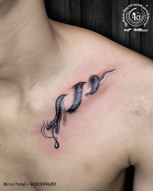 Small Blackwork Snake on Men Shoulder Tattoo by @mitul_tattoo