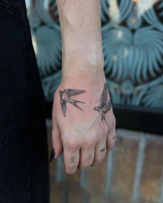 Small Blackwork Sparrows Tattoo on Women Hand by @supersweettattoo
