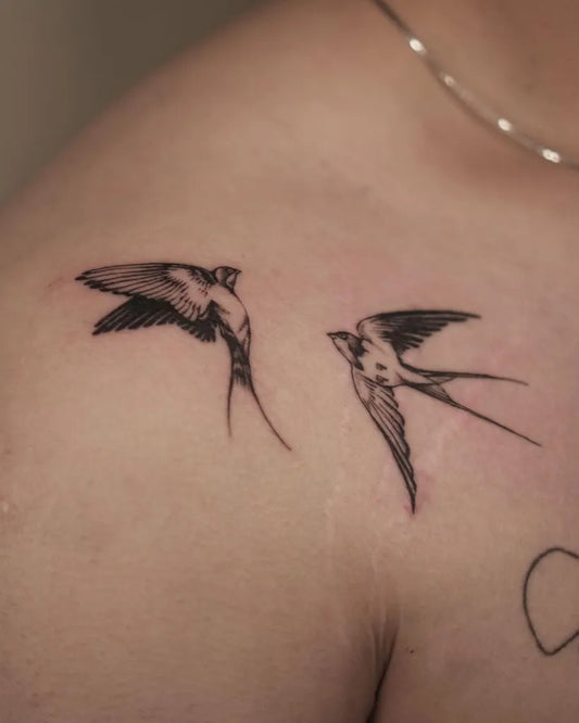 Small Blackwork Sparrows Tattoo on Women Shoulder by @stabbystabttt