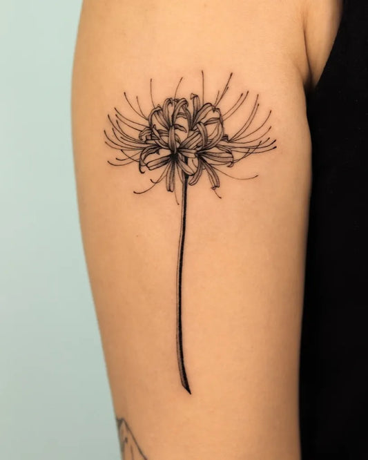 Small Blackwork Spider Lily Tattoo on Women Arm by @kashatattooer