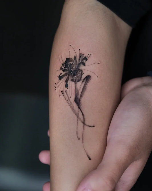 Small Blackwork Spider Lily Tattoo on Women Arm by @ovv_tattoo