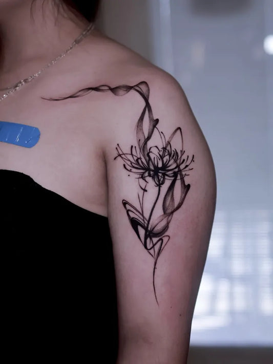 Small Blackwork Spider Lily Tattoo on Women Shoulder by @zuxgos