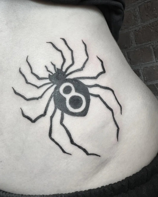 Small Blackwork Spider Tattoo on Women Stomach by @antclaytattoo