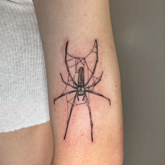 Small Blackwork Spider Web on Women Arm Tattoo by @chloeshaytattoo