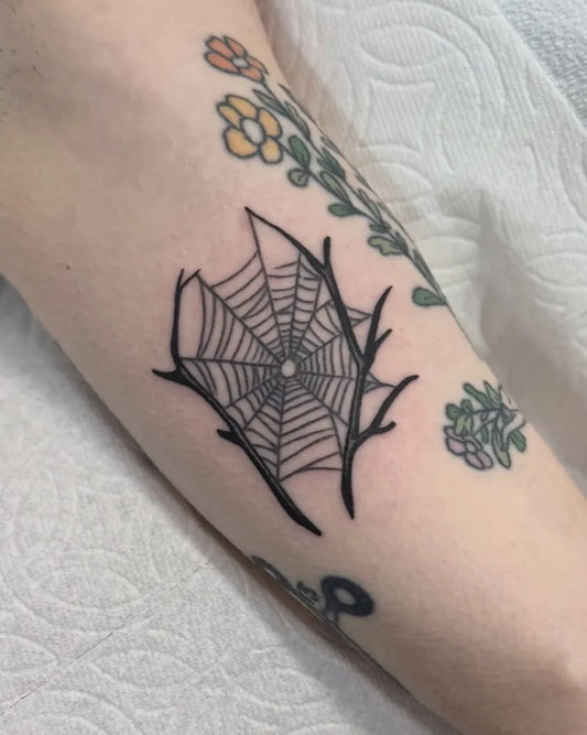 Small Blackwork Spider Web with Flowers on Women Arm Tattoo by @niaink