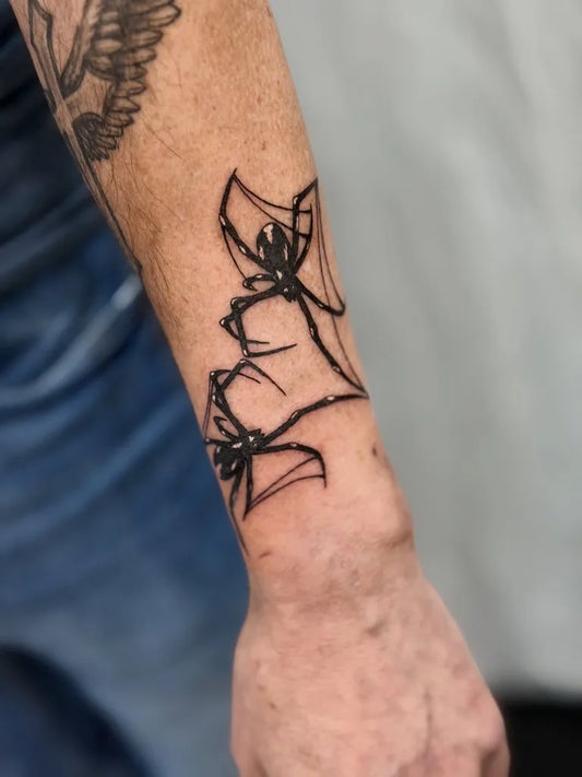 Small Blackwork Spider and Flowers on Men Wrist Tattoo by @belasantosink_
