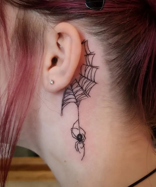 Small Blackwork Spider and Web Tattoo on Women Behind the Ear by @golden.eye.tattoo