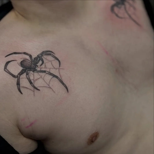 Small Blackwork Spider and Web on Men Chest Tattoo by @kokoa_art