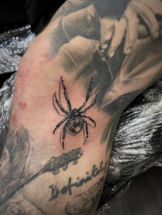 Small Blackwork Spider on Men Knee Tattoo by @etch__tattz