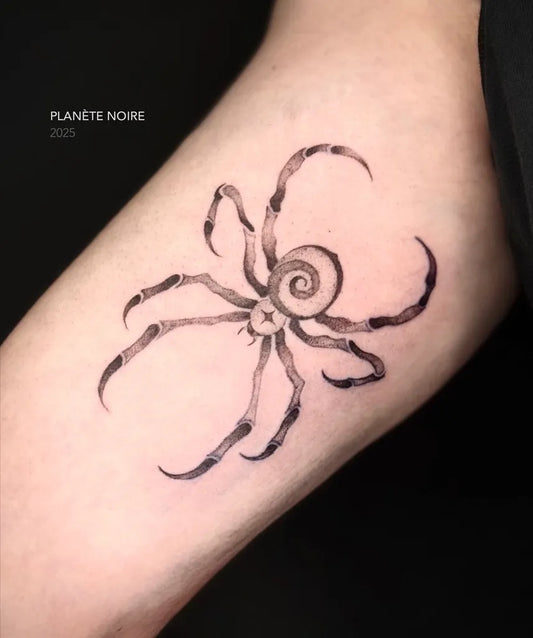 Small Blackwork Spider on Women Arm Tattoo by @planete.noire