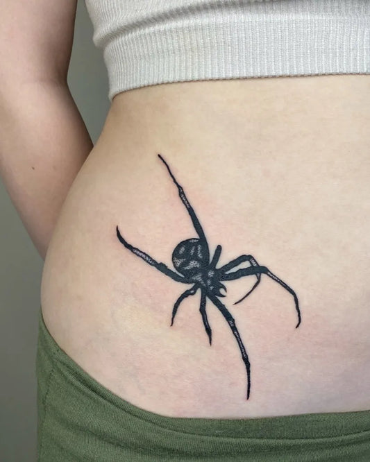 Small Blackwork Spider on Women Hip Tattoo by @leery.tattoos