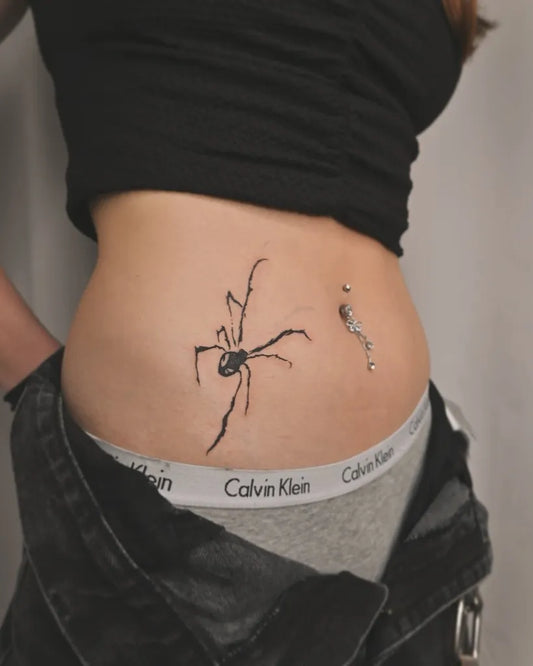 Small Blackwork Spider on Women Side Tattoo by @just_mo_tattoo