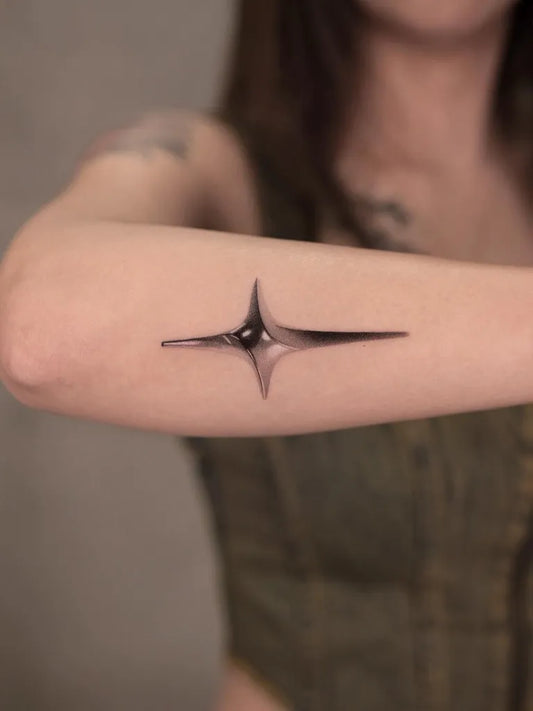 Small Blackwork Star Tattoo on Women Arm by @gall1um_ink