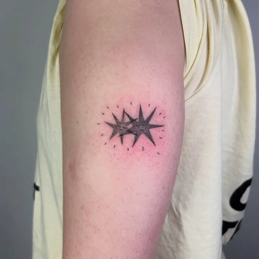 Small Blackwork Star Tattoo on Women Arm by @scratchymoon.tattoo