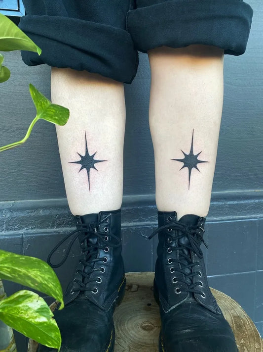 Small Blackwork Star Tattoo on Women Legs by @silly_little_tattooist