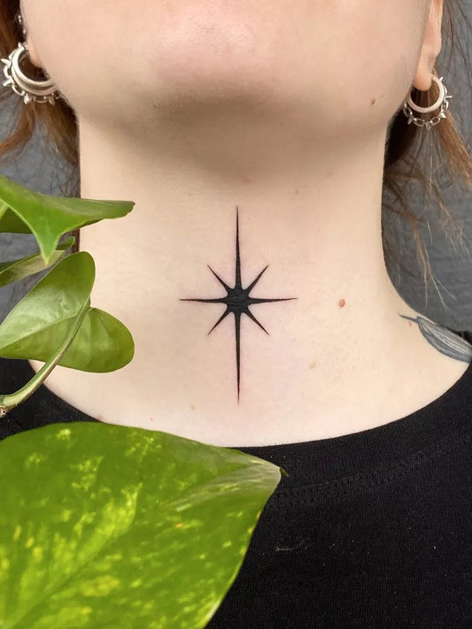 Small Blackwork Star Tattoo on Women Throat by @silly_little_tattooist
