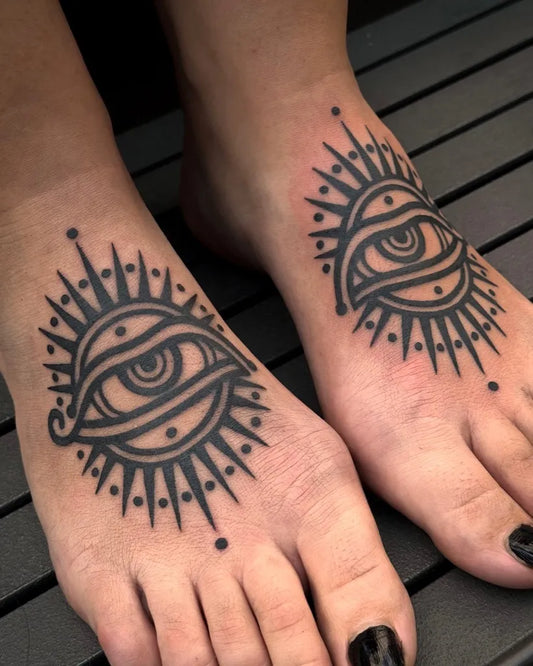 Small Blackwork Sun Eye on Women Feet Tattoo by @luxotattoox