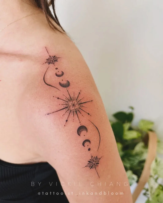 Small Blackwork Sun Moon Stars on Women Shoulder Tattoo by @tattooist_inkandbloom