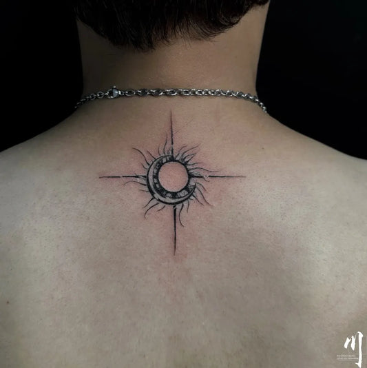 Small Blackwork Sun and Moon Tattoo on Men Back by @tattooming1
