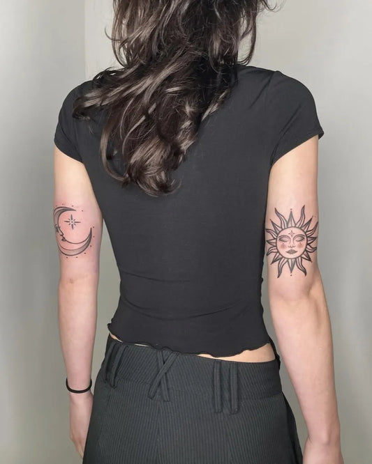 Small Blackwork Sun and Moon on Women Upper Arms Tattoo by @vora.ink