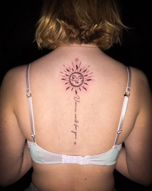 Small Blackwork Sun and Quote on Women Spine Tattoo by @mayink_official