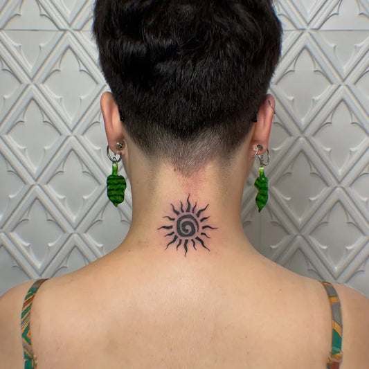 Small Blackwork Sun on Women Neck Tattoo by @jekoluan.tattoo