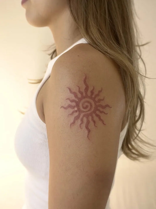 Small Blackwork Sun on Women Shoulder Tattoo by @namaste_poke