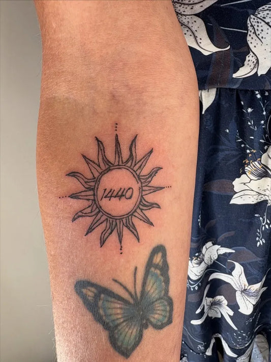 Small Blackwork Sun with Compass and Date on Women Arm Tattoo by @inked._byash_