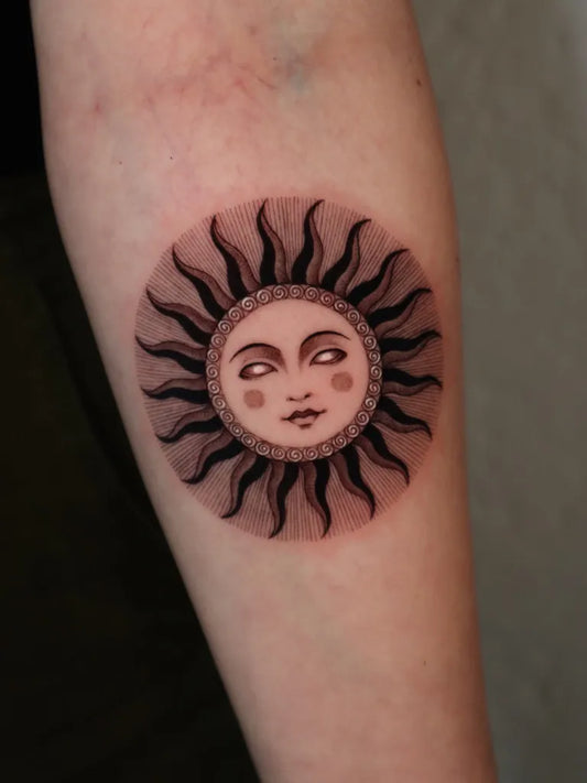 Small Blackwork Sun with Face on Women Forearm Tattoo by @kissami_ink